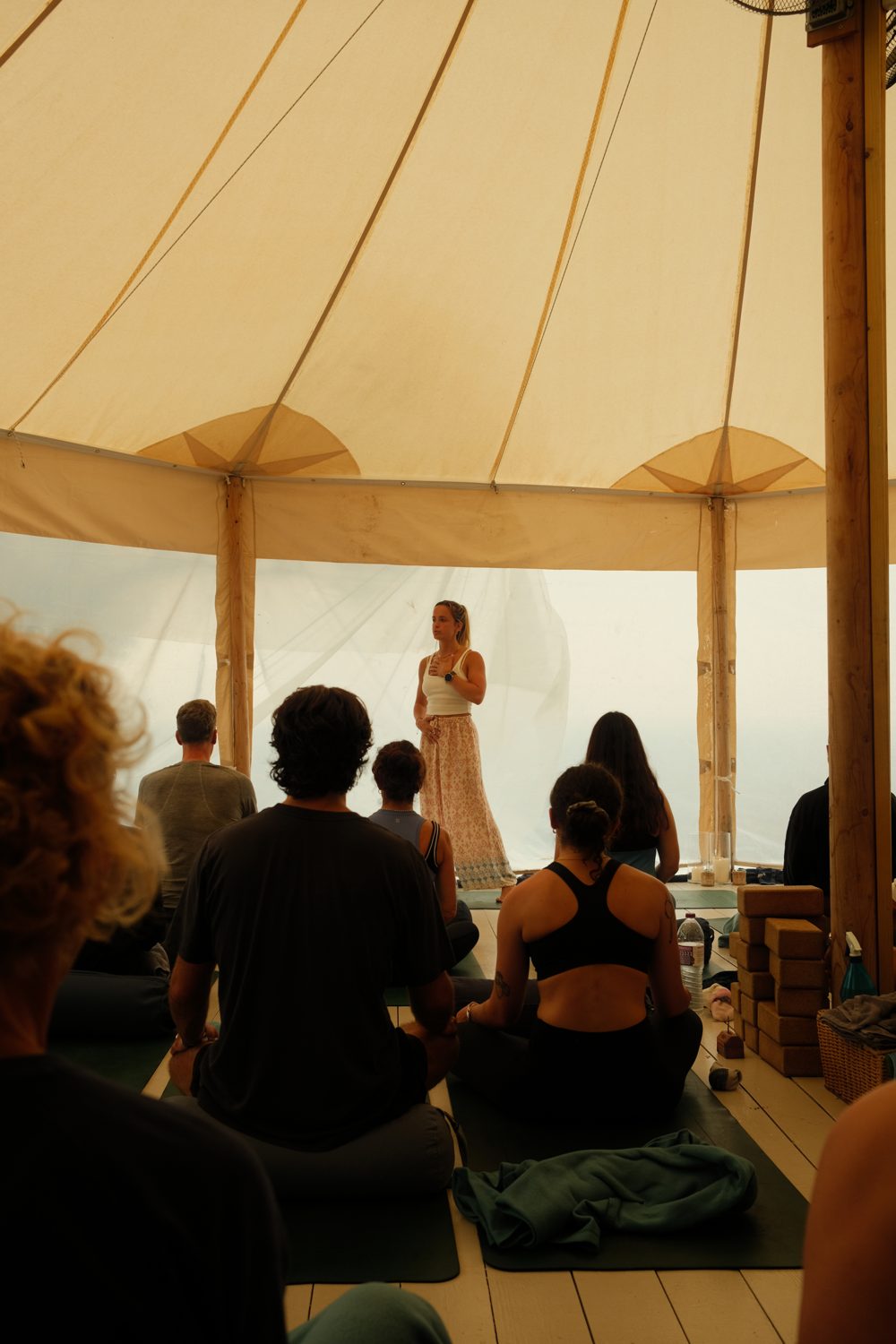 Tamara leading a workshop in a canvas tent